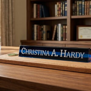 Finished layered epoxy desk nameplate on an oak base