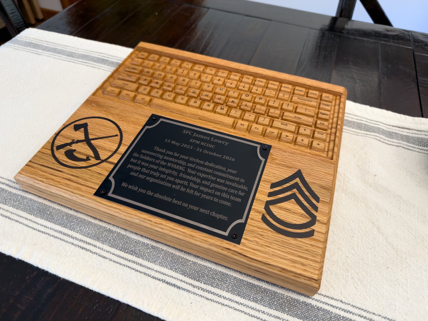 Custom wooden plaque with engraved keyboard design