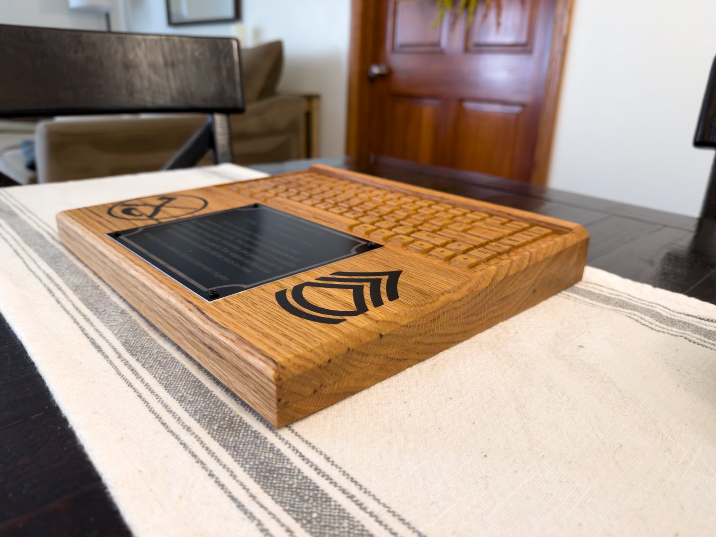 Custom wooden plaque displayed on a dining table