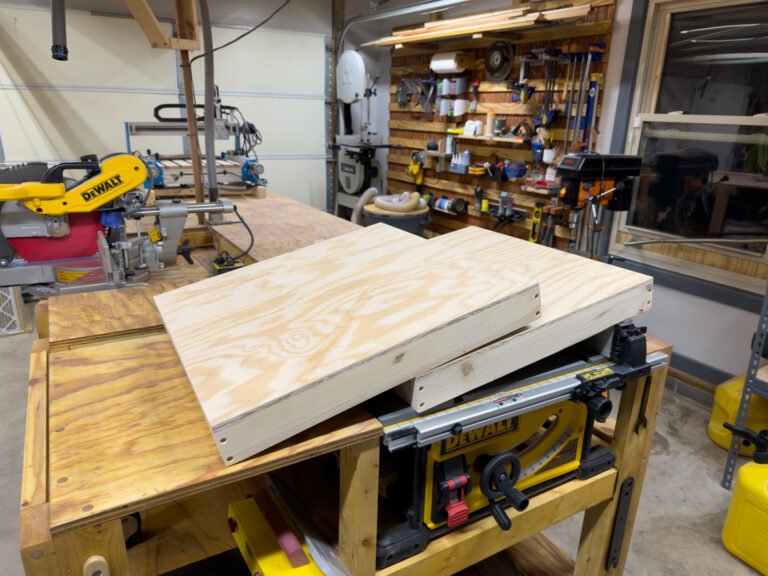 Wooden board top for a brew boards toss game set on a table saw in the workshop