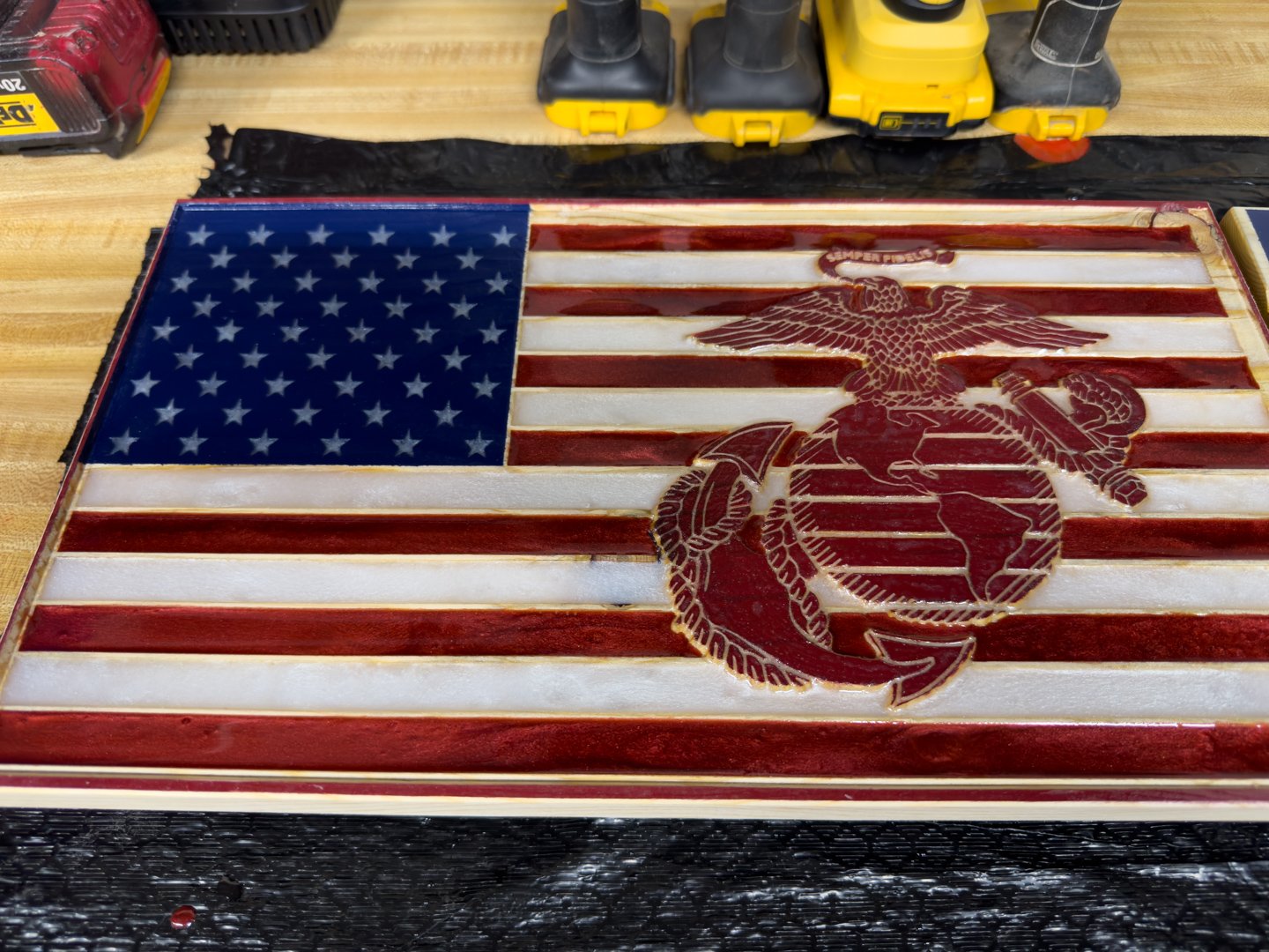 Handmade wooden American flag panel with red and white stripes, blue star field, and a deep red Marine Corps emblem
